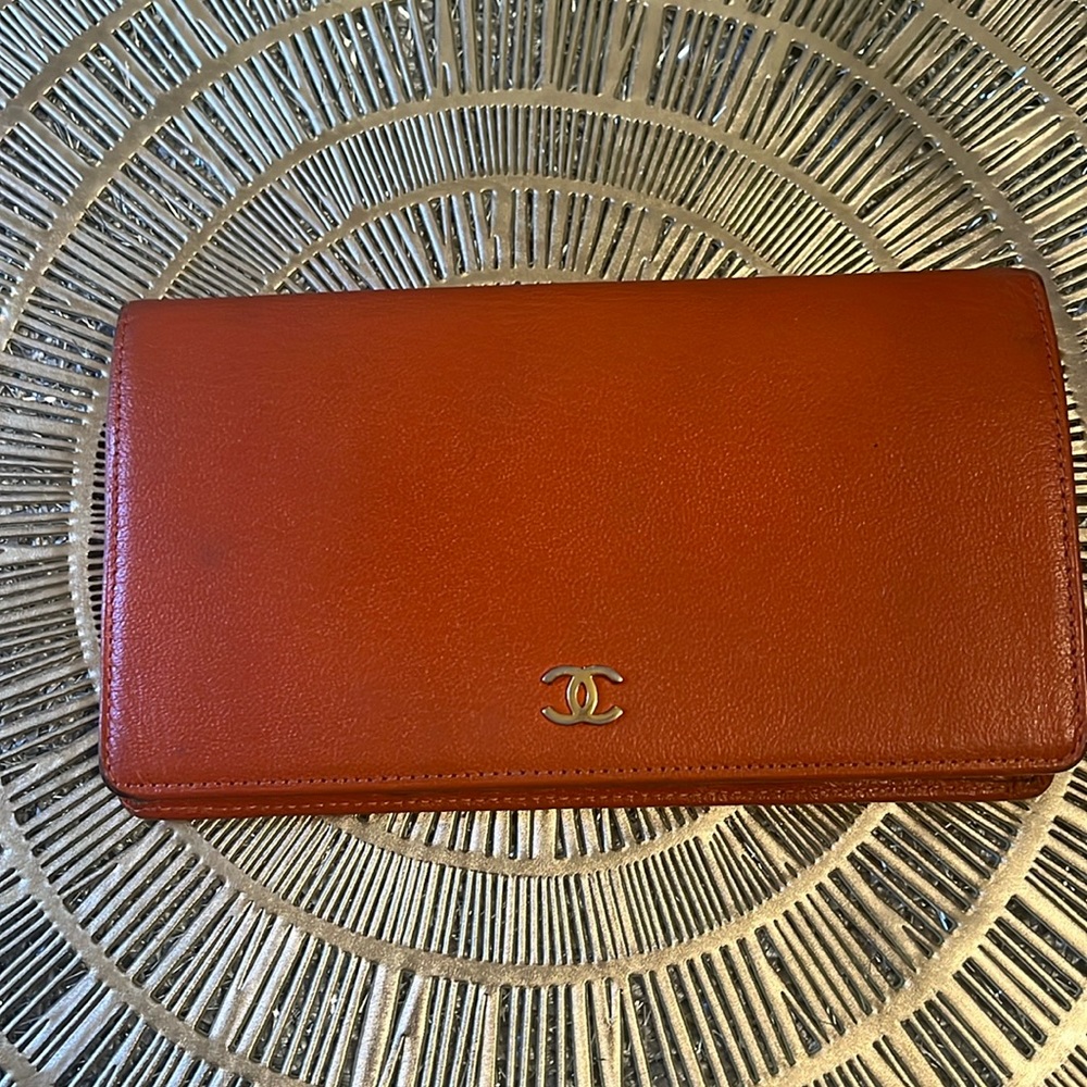 Well loved orange Chanel wallet